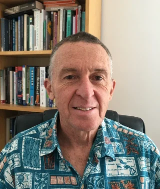 Michael Clement, online counsellor and supervisor sitting in his therapy room in Cornwall